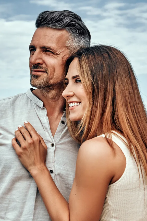 Medical-Genetic-Testing-Treatment A healthy middle-aged couple look out onto the ocean. Get Medical Genetic Testing from Tanya Zboril, NP of TBT Medical in Ottawa–Gatineau.