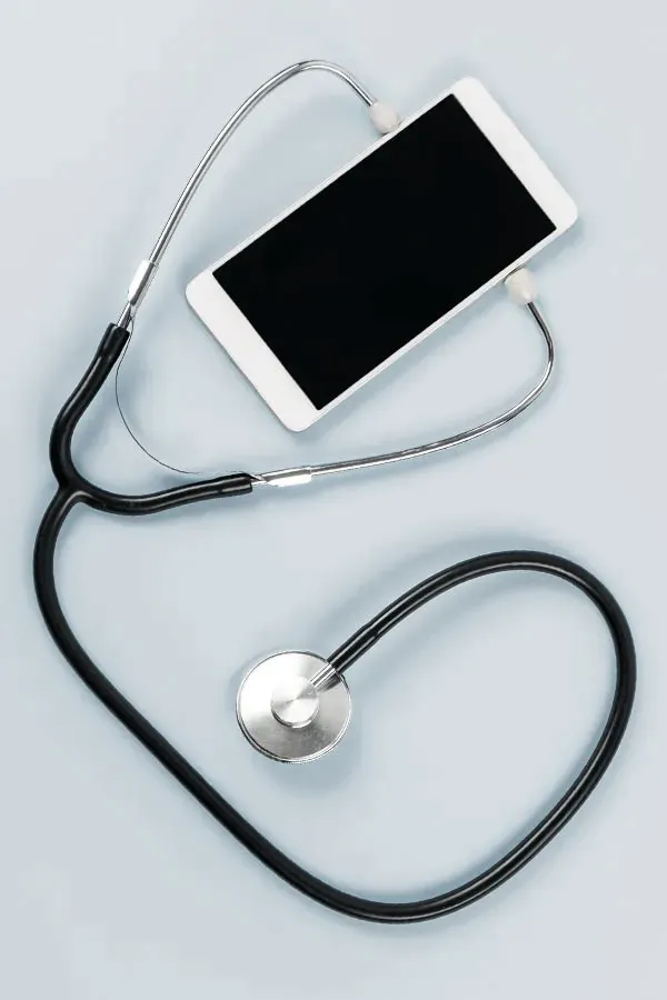 Telemedicine-Treatment A smartphone with a stethoscope attached to it, symbolizing Telemedicine treatment from Tanya Zboril, NP of TBT Medical in Ottawa–Gatineau.